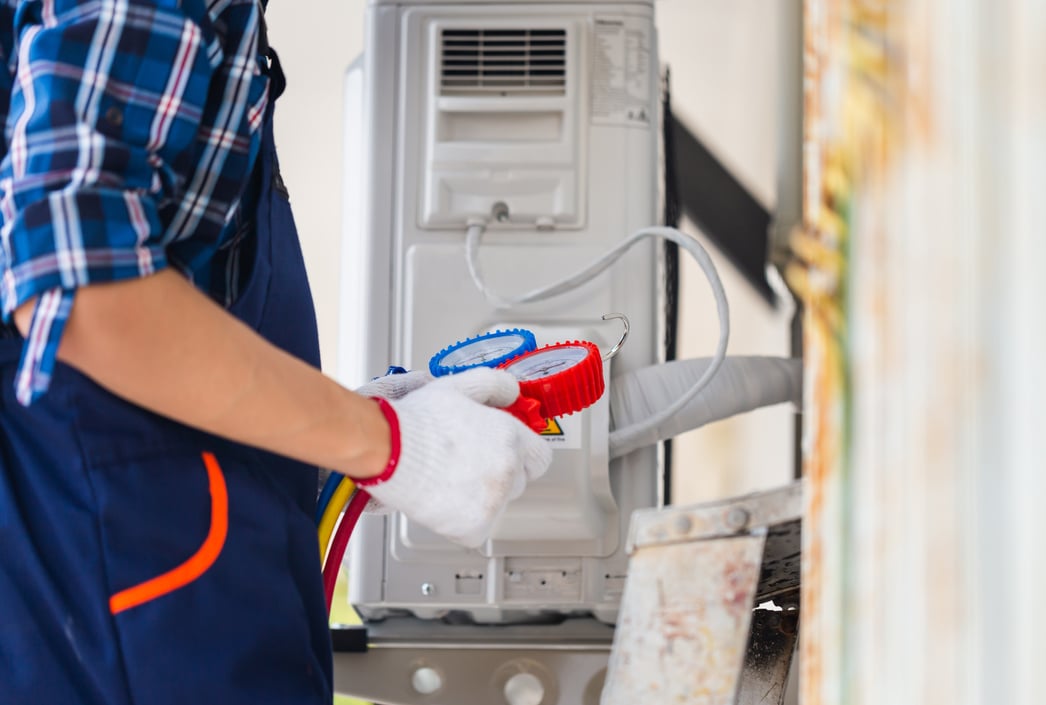 Air Conditioning Repair, Repairman fixing air conditioning syste